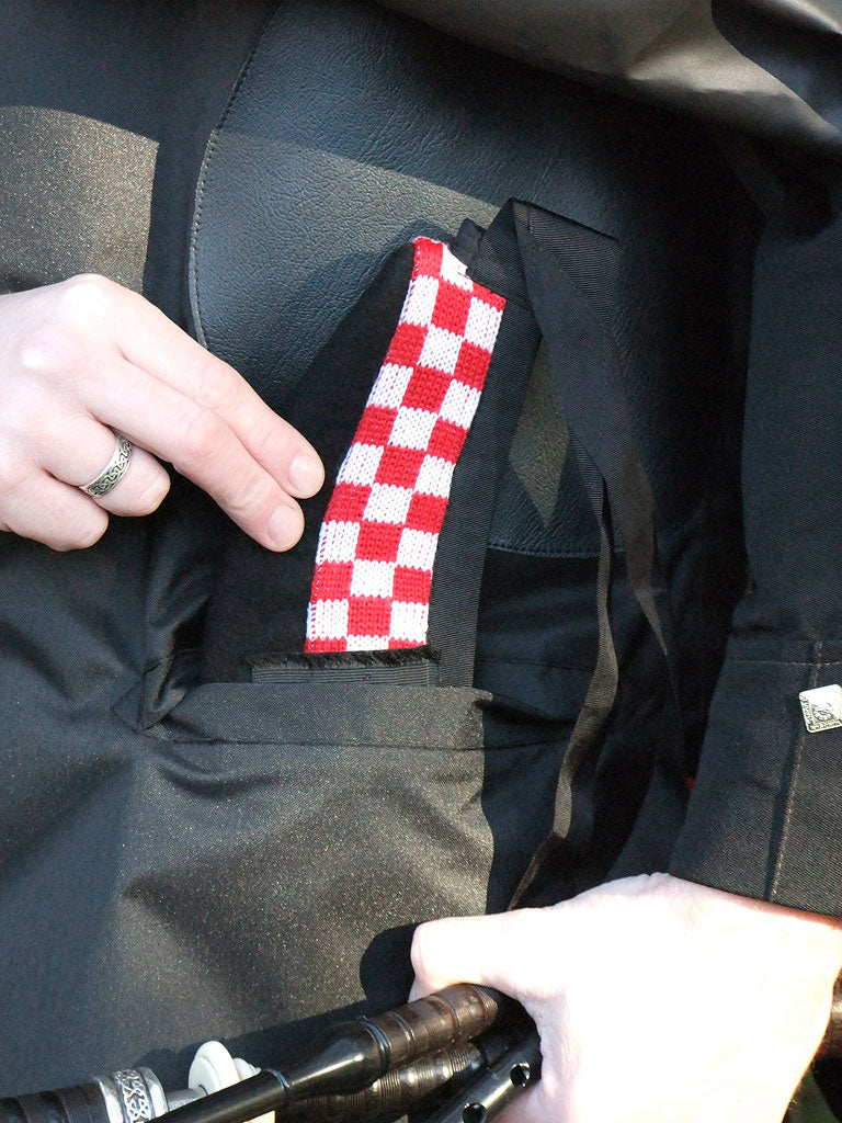 Bandspec Raincape — worn by piper on parade